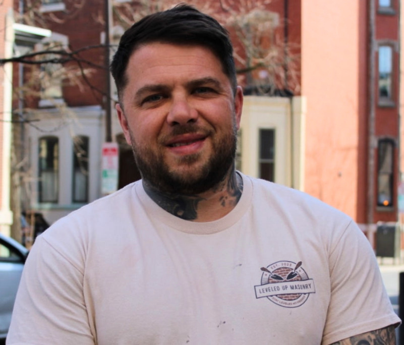 Leveled Up Masonry crew restoring a Philadelphia brownstone facade